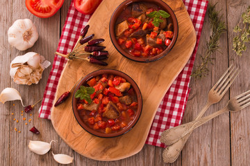 Marinated pork loin in tomato sauce.
