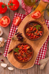 Marinated pork loin in tomato sauce.