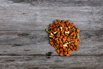 Dog food on wooden texture background