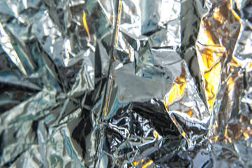 Rumpled silver foil with reflections of light