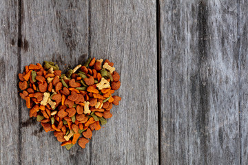 Dog food on wooden texture background
