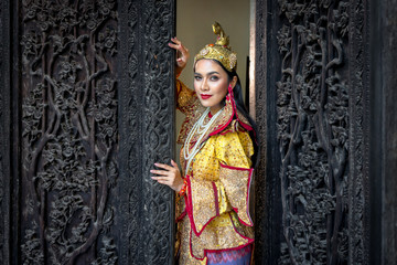 Fototapeta na wymiar Burmese beautiful woman in antique Myanmar or Burma traditional national dress costume clothes
