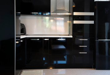 Close up of kitchen interior with black furniture