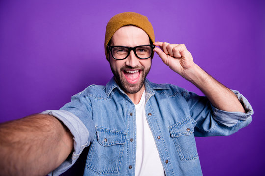Photo of excited guy online video translation for blog wear specs casual denim outfit isolated violet background