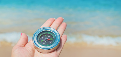 compass on the sea coast. Selective focus.