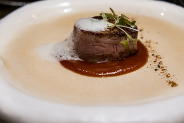 Juicy delicious beef fillet steak mignon served on a plate in a restaurant