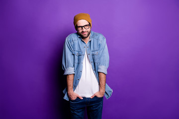 Portrait of his he nice attractive discontent bearded guy holding hands in pockets avoiding ignoring participation isolated over bright vivid shine violet lilac purple background