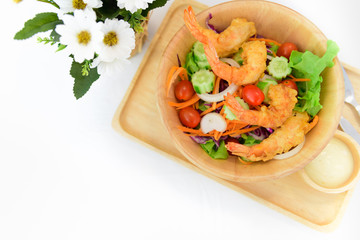 Fried shrimp salad on white table