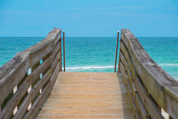 Ponce de Leon Inlet, Florida. July 19, 2019 Small boardwalk and green see at lighthouse area 2