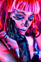Woman with fluor sugar skull makeup