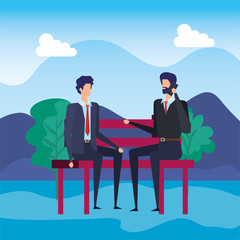 Fototapeta premium elegant businessmen calling with cellphones in the park chair