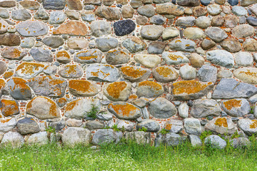 Medieval fortress- brick stone wall. Outdoor architecture- vintage rock