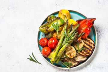 Grilled vegetables - zucchini, paprika, eggplant, asparagus and tomatoes. - obrazy, fototapety, plakaty