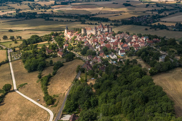 Village and castle of burgundy in France. View from above by a drone