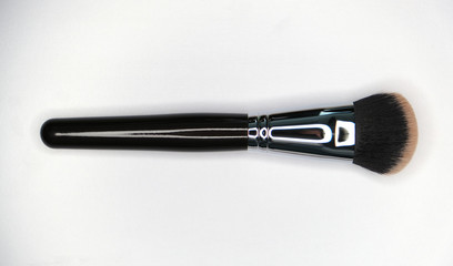 Isolate cosmetic brush on the white texture 