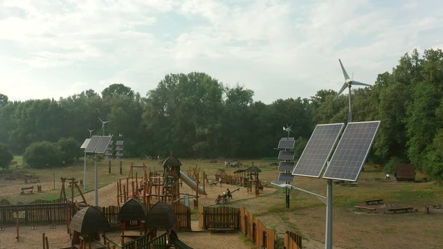 Flight over a deca square with solar panels in Poland. Aerial shot in Photovoltaic solar panels absorb sunlight as an energy source for generating electricity, creating sustainable energy. 