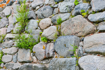 Medieval fortress- brick stone wall. Outdoor architecture- vintage rock