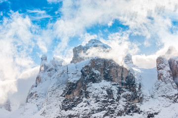Fototapeta na wymiar Dolomite Mountains covered with clouds in winter, view for the Brunecker Turm.