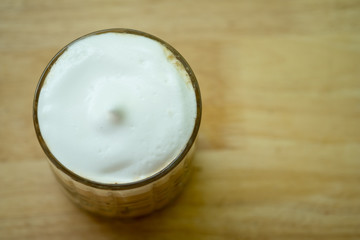 Milk foam on iced beverage