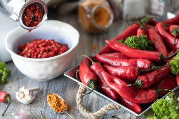 Red hot mini pepper on wooden background.