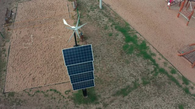 Flight over a deca square with solar panels in Poland. Aerial shot in Photovoltaic solar panels absorb sunlight as an energy source for generating electricity, creating sustainable energy. 