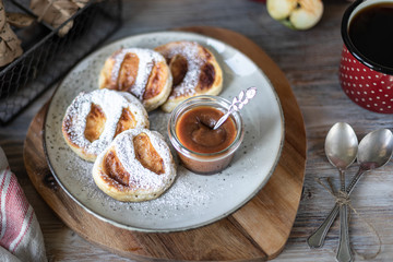 Fresh homemade pancake with apples, honey and cinnamon