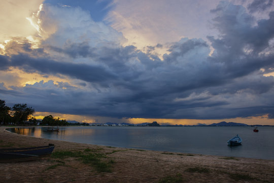 Windstorm, dramatic sky and sun beams over Ao Manao bay, Ao Manao beach and Prachuap bay from Kao Lom Muak mountain in Prachuap Khiri Khan province of Thailand.