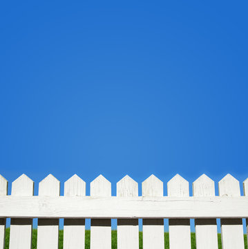 White Picket Fence And Blue Sky