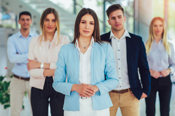 Group of happy business people and company staff in modern office, representing company