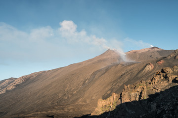Fototapeta na wymiar Etna eruption and the Moon