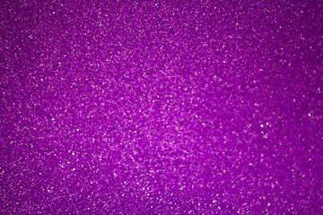 abstract blurred purple background with shiny bokeh