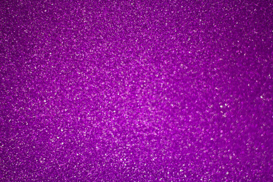 abstract blurred purple background with shiny bokeh