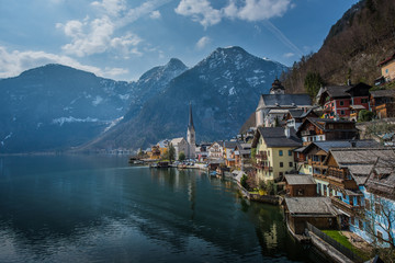 Fototapeta na wymiar Popular scenic view of Hallstatt town, Austria in summer time with blue sky and clear lake