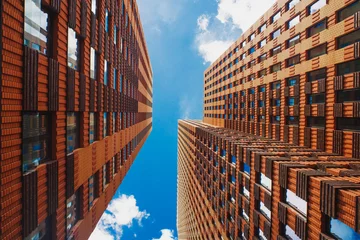 Foto op Aluminium Look up view on orange skyscrapers in Amsterdam business district © Kirill