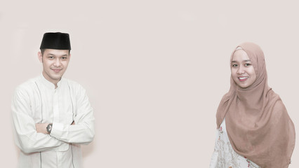 Portrait of cheerful young muslim man smiling in front of camera