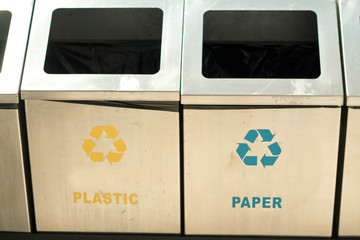 Containers for separate waste collection: organic, paper, plastic for recycling.