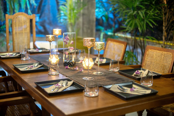Dinner set on the wood table with long wine glass