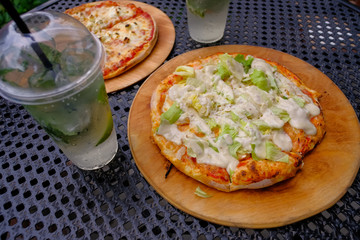 Two circles of Italian pizza. Pizza Caesar and pizza 