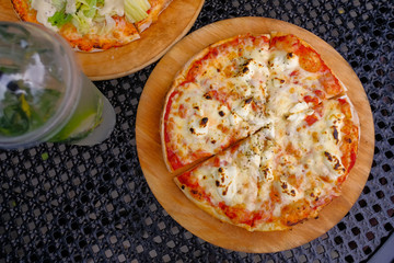 Two circles of Italian pizza. Pizza Caesar and pizza 