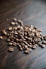 Close-up coffee beans on a dark wood background