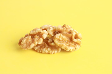 Peeled walnuts in colorful background