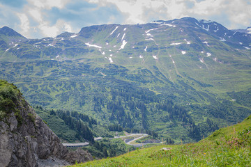 Naklejka premium Mountain landscape in summer in the Alps. for relaxation and tourism with the possibility to see cows on the meadows