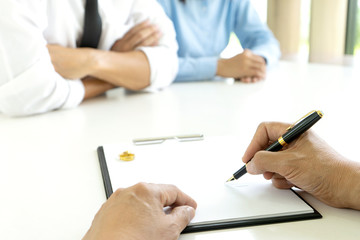 Fototapeta premium in the law office, man and woman sit at the table to sign