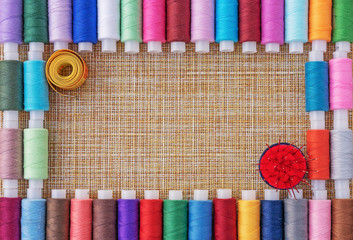 Multicolored sewing threads. Spools of thread for sewing. The concept of sewing accessories.