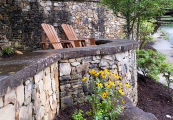 Two chairs on a stone ledge 1