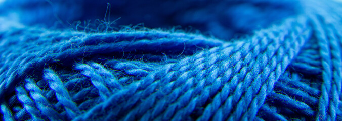 A ball of blue yarn close-up.