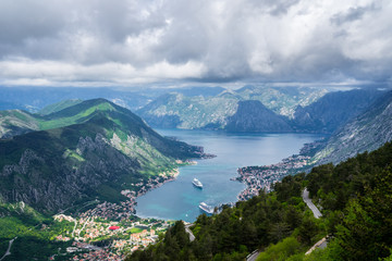 Montenegro, Houses of kotor bay city from above surrounded by majestic mountains nature landscape © Simon Dux Media