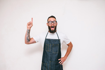 Portrait of a happy young crazy chef cook isolated on a white background