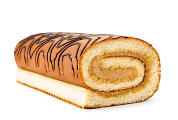 Biscuit roll cake closeup on a white. Isolated