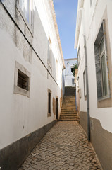 narrow street in old town of lisbon portugal